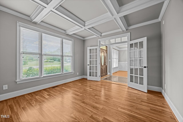 1124 Kalworth Rd, Wake Forest, NC 27587 - empty room featuring french doors, coffered ceiling, wood finished floors, beam ceiling, and ornamental molding