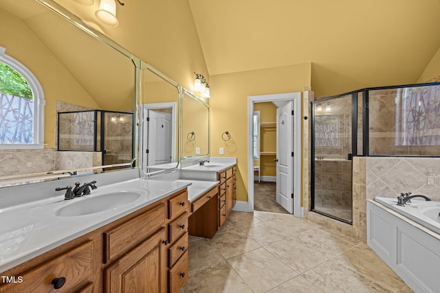 1124 Kalworth Rd, Wake Forest, NC 27587 - bathroom featuring lofted ceiling, a shower stall, vanity, a bath, and tile patterned floors
