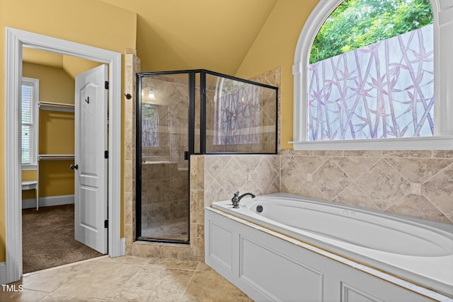 1124 Kalworth Rd, Wake Forest, NC 27587 - bathroom featuring a stall shower, a garden tub, a walk in closet, and lofted ceiling