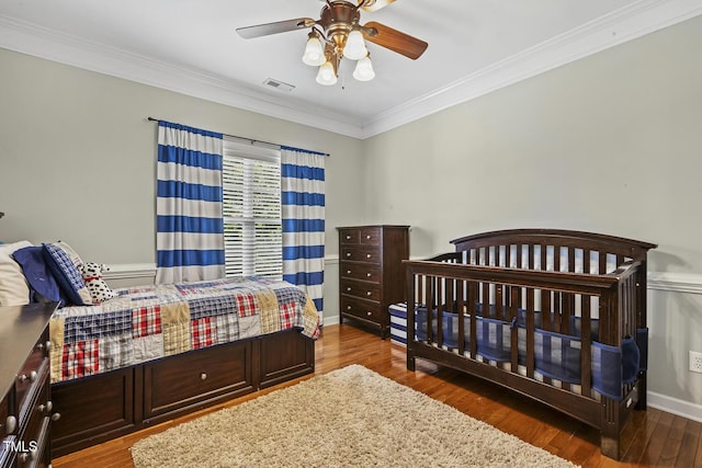 5516 Colonial Oaks Dr, Apex, NC 27539 - bedroom with wood finished floors, crown molding, a ceiling fan, and baseboards