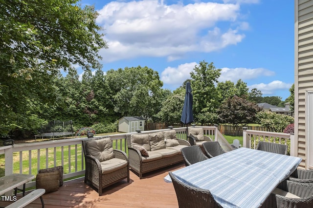5516 Colonial Oaks Dr, Apex, NC 27539 - deck with a trampoline, outdoor dining space, and outdoor lounge area
