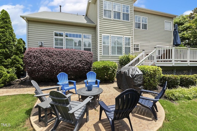 5516 Colonial Oaks Dr, Apex, NC 27539 - rear view of house featuring a patio, a deck, and an outdoor fire pit