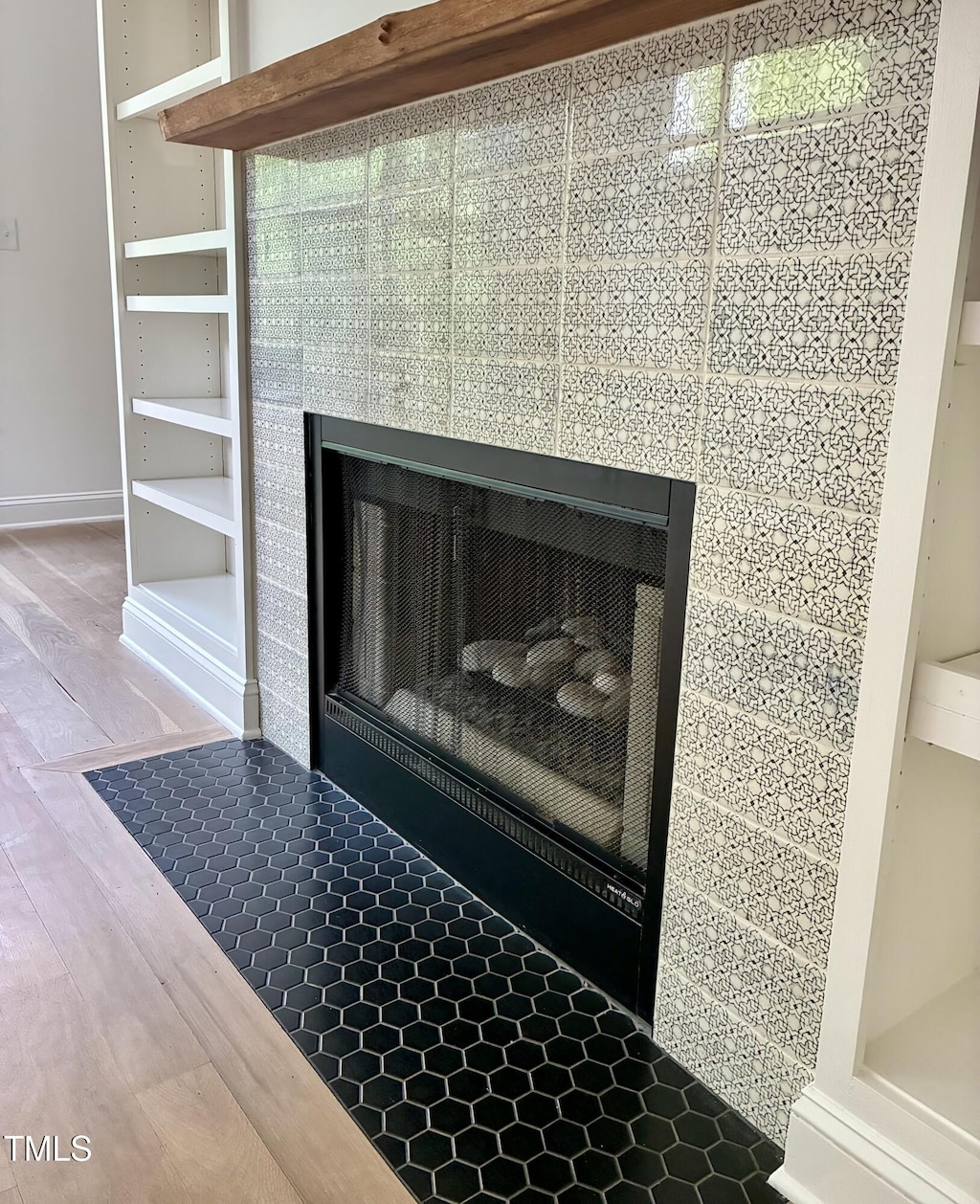 508 N Wake St, Hillsborough, NC 27278 - detailed view of a tile fireplace and wood finished floors