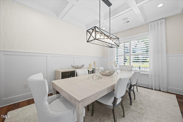 111 Stone Park Dr, Wake Forest, NC 27587 - dining space with coffered ceiling, wood finished floors, a chandelier, a decorative wall, and beam ceiling