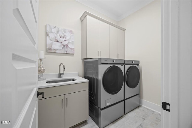 111 Stone Park Dr, Wake Forest, NC 27587 - washroom with washing machine and clothes dryer, cabinet space, and crown molding