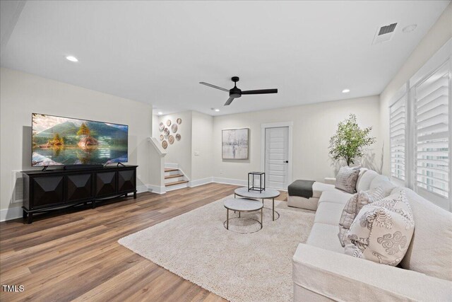 111 Stone Park Dr, Wake Forest, NC 27587 - living area with stairs, wood finished floors, ceiling fan, recessed lighting, and baseboards