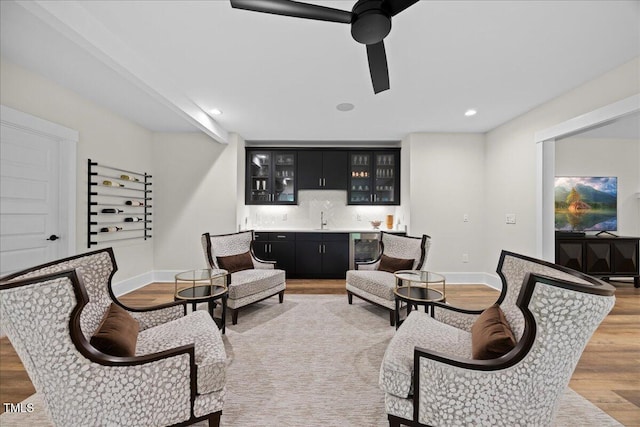 111 Stone Park Dr, Wake Forest, NC 27587 - sitting room featuring bar with sink, light wood-type flooring, baseboards, and recessed lighting