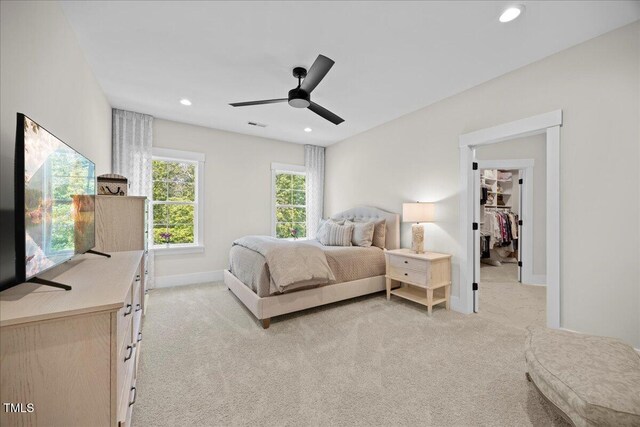 111 Stone Park Dr, Wake Forest, NC 27587 - bedroom featuring light colored carpet, recessed lighting, baseboards, a walk in closet, and ceiling fan