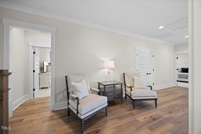 111 Stone Park Dr, Wake Forest, NC 27587 - sitting room with ornamental molding, wood finished floors, baseboards, and recessed lighting