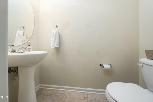 1017 Frank Page Dr, Cary, NC 27511 - bathroom featuring toilet, baseboards, and a sink