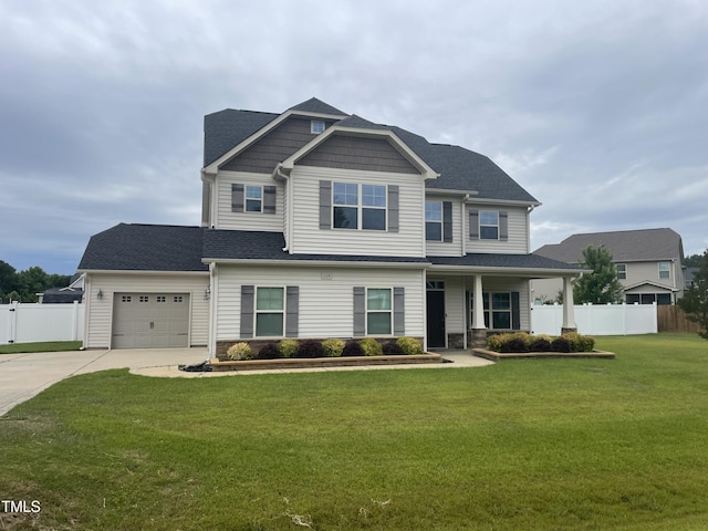 608 Thornbrooke Dr, Hope Mills, NC 28348 - craftsman-style home with concrete driveway, a garage, and covered porch