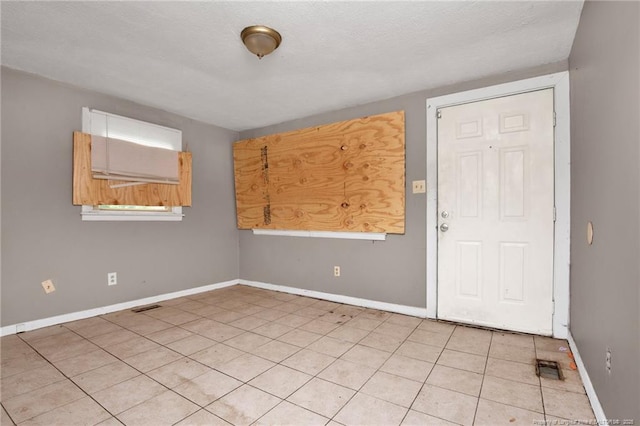 6200 Arabia Rd, Lumber Bridge, NC 28357 - empty room featuring baseboards and light tile patterned flooring
