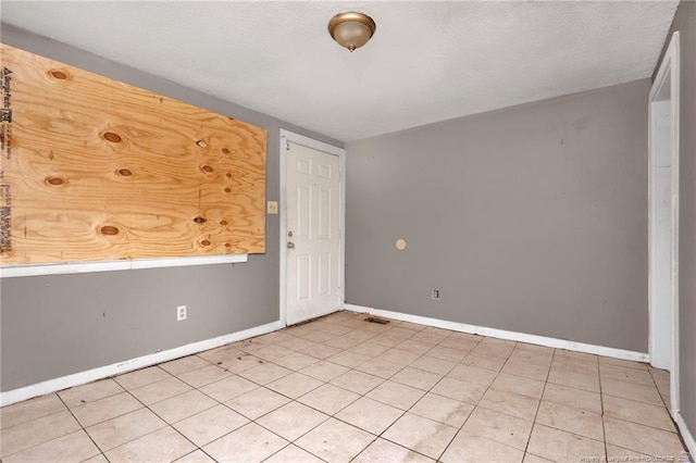 6200 Arabia Rd, Lumber Bridge, NC 28357 - unfurnished room featuring baseboards and light tile patterned floors