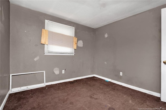 6200 Arabia Rd, Lumber Bridge, NC 28357 - carpeted empty room featuring baseboards