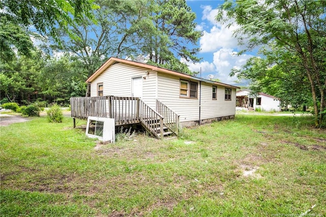 6200 Arabia Rd, Lumber Bridge, NC 28357 - back of property with a yard and a deck