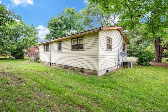 6200 Arabia Rd, Lumber Bridge, NC 28357 - view of side of home featuring crawl space, a yard, and central air condition unit