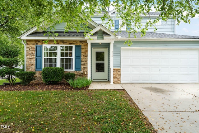 518 Clearfield Dr, Durham, NC 27703 - view of front facade with stone siding, driveway, a garage, and roof with shingles