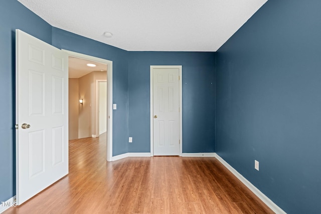 518 Clearfield Dr, Durham, NC 27703 - spare room featuring wood finished floors