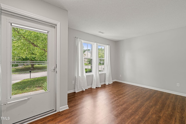 518 Clearfield Dr, Durham, NC 27703 - entryway with dark wood-style floors and a textured ceiling