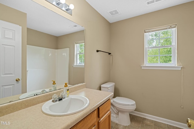 518 Clearfield Dr, Durham, NC 27703 - bathroom with vanity, a shower, and tile patterned floors