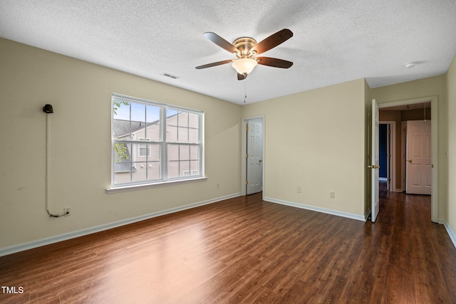 518 Clearfield Dr, Durham, NC 27703 - unfurnished bedroom with dark wood-style floors, a textured ceiling, and ceiling fan