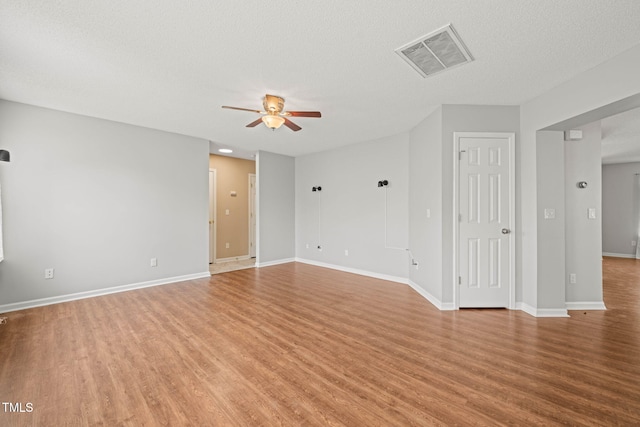 518 Clearfield Dr, Durham, NC 27703 - unfurnished room with a ceiling fan, wood finished floors, and a textured ceiling