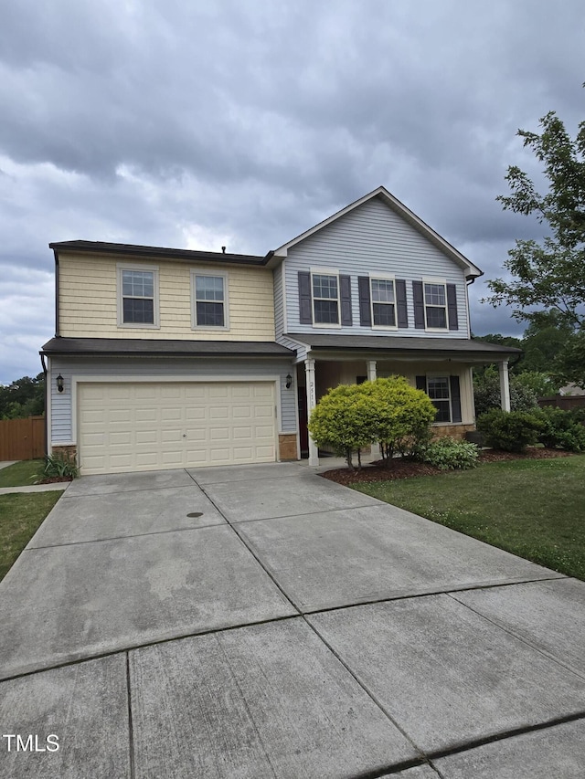 2511 Dalmahoy Ln, Fuquay Varina, NC 27526 - traditional-style house featuring a garage and driveway