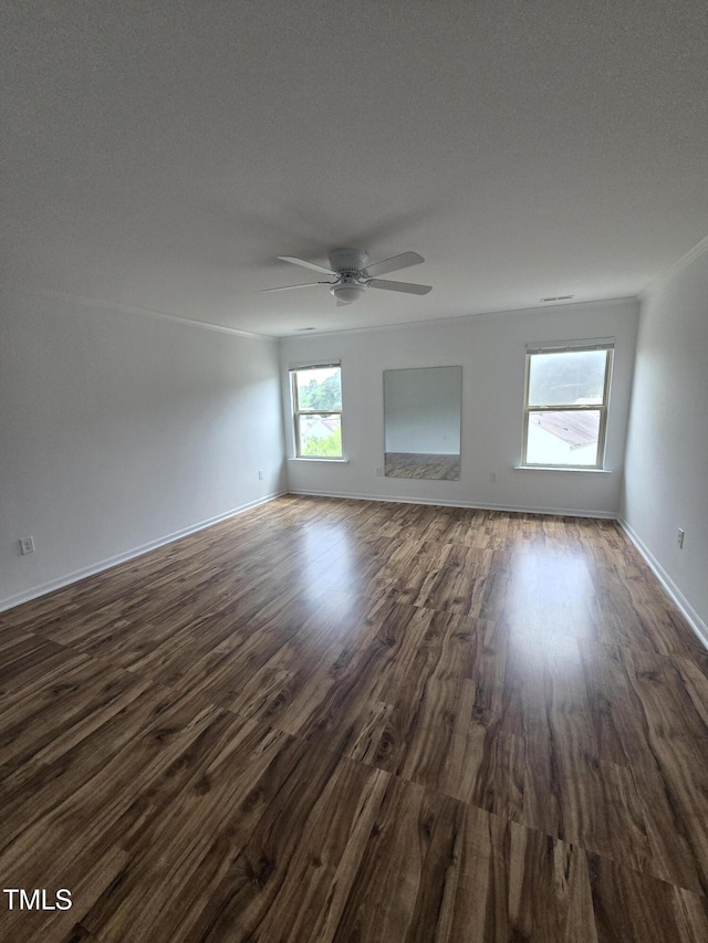 2511 Dalmahoy Ln, Fuquay Varina, NC 27526 - spare room with ceiling fan, dark wood finished floors, and baseboards