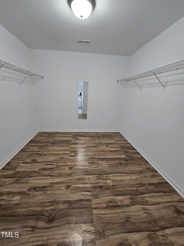 2511 Dalmahoy Ln, Fuquay Varina, NC 27526 - spacious closet featuring dark wood-style floors and electric panel