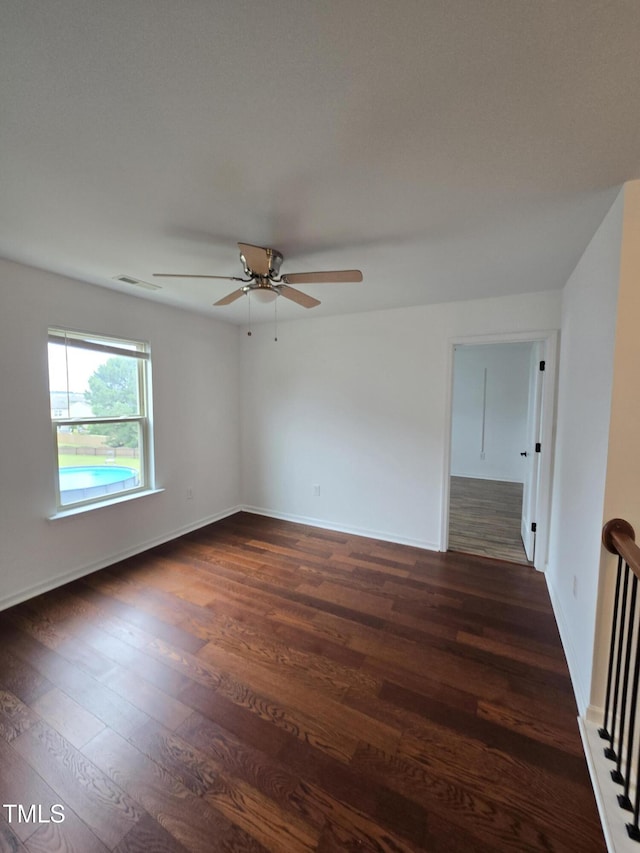 2511 Dalmahoy Ln, Fuquay Varina, NC 27526 - empty room featuring ceiling fan, dark wood-style floors, and baseboards