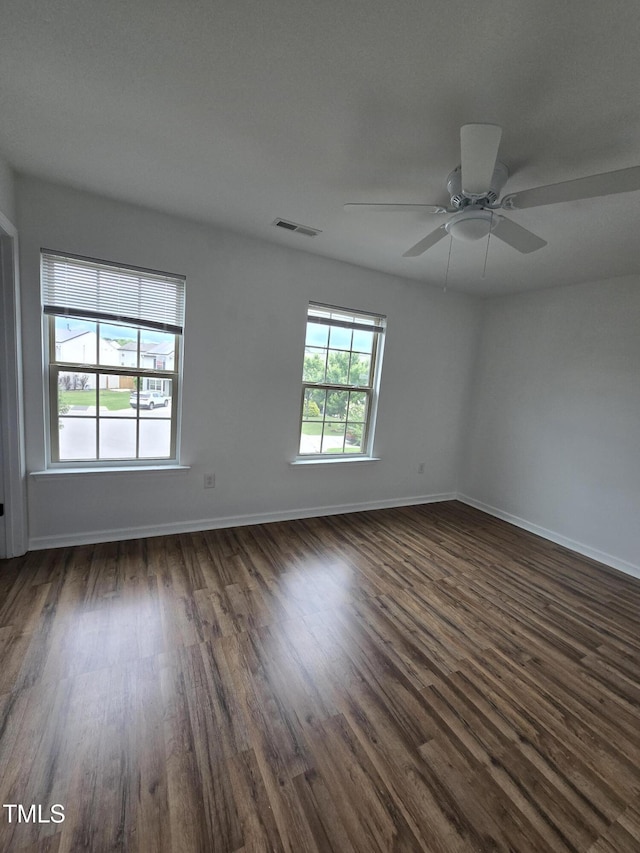 2511 Dalmahoy Ln, Fuquay Varina, NC 27526 - unfurnished room featuring dark wood-type flooring, baseboards, and a ceiling fan