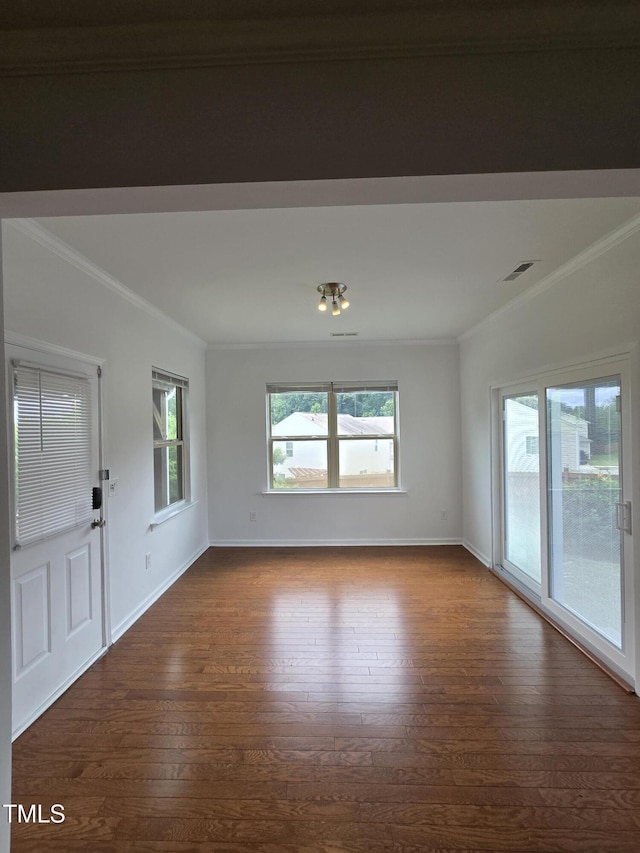 2511 Dalmahoy Ln, Fuquay Varina, NC 27526 - unfurnished room featuring crown molding, dark wood-type flooring, and baseboards