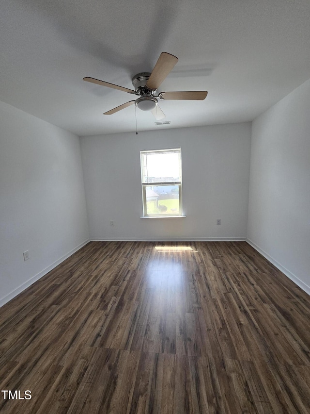 2511 Dalmahoy Ln, Fuquay Varina, NC 27526 - unfurnished room featuring dark wood-style floors, ceiling fan, and baseboards