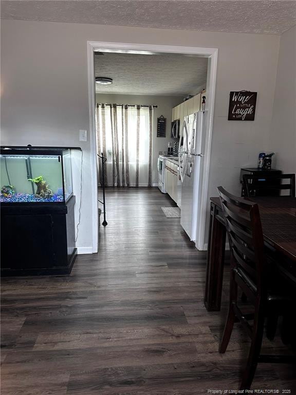 6532 Kemper Ct, Fayetteville, NC 28303 - hall featuring a textured ceiling and dark wood-style flooring