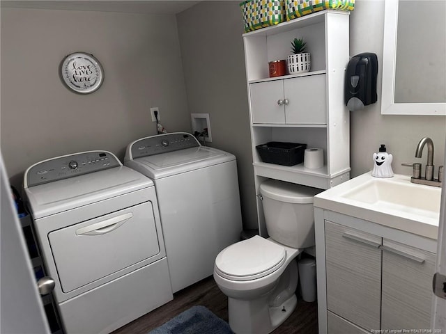 6532 Kemper Ct, Fayetteville, NC 28303 - bathroom featuring washer and dryer, vanity, and wood finished floors