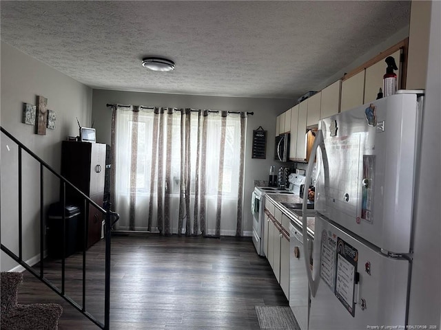 6532 Kemper Ct, Fayetteville, NC 28303 - kitchen featuring white appliances, dark wood-type flooring, a textured ceiling, and white cabinetry