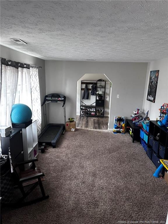 6532 Kemper Ct, Fayetteville, NC 28303 - exercise area featuring carpet and a textured ceiling