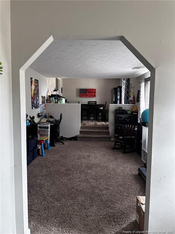6532 Kemper Ct, Fayetteville, NC 28303 - carpeted living area featuring a textured ceiling