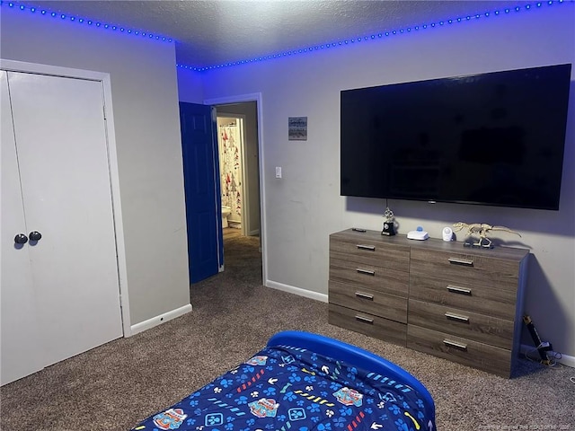 6532 Kemper Ct, Fayetteville, NC 28303 - bedroom featuring dark colored carpet and a textured ceiling