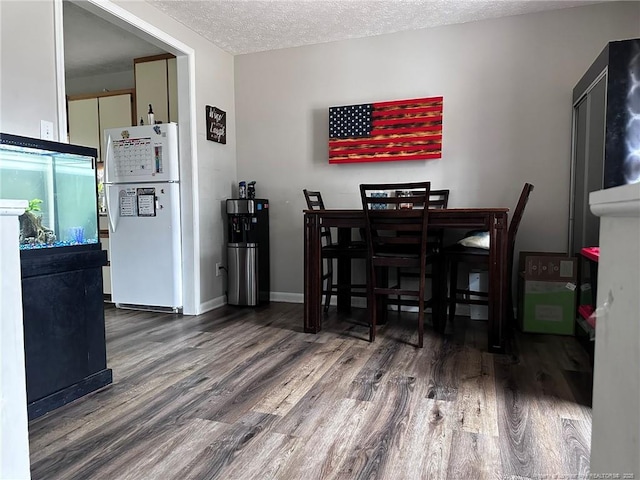 6532 Kemper Ct, Fayetteville, NC 28303 - dining room featuring wood finished floors and a textured ceiling