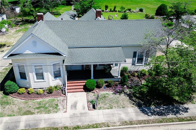 208 W Thompson St E, Fairmont, NC 28340 - view of front of property featuring roof with shingles, covered porch, and a chimney