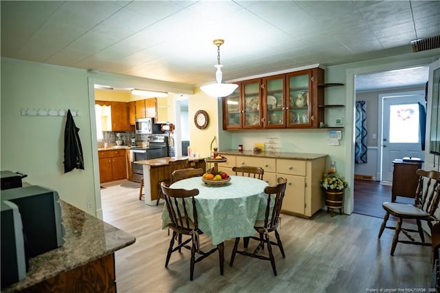 208 W Thompson St E, Fairmont, NC 28340 - dining area with light wood-style flooring