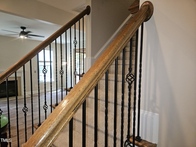 112 Briarfield Dr, Apex, NC 27502 - stairway with ceiling fan and wood finished floors
