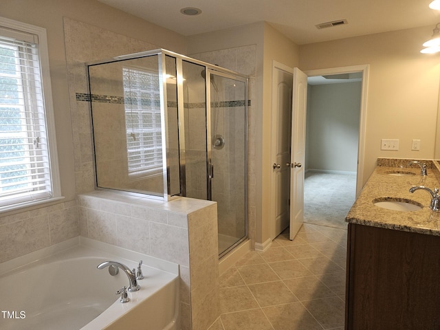 112 Briarfield Dr, Apex, NC 27502 - full bath with a bath, a shower stall, tile patterned floors, and double vanity