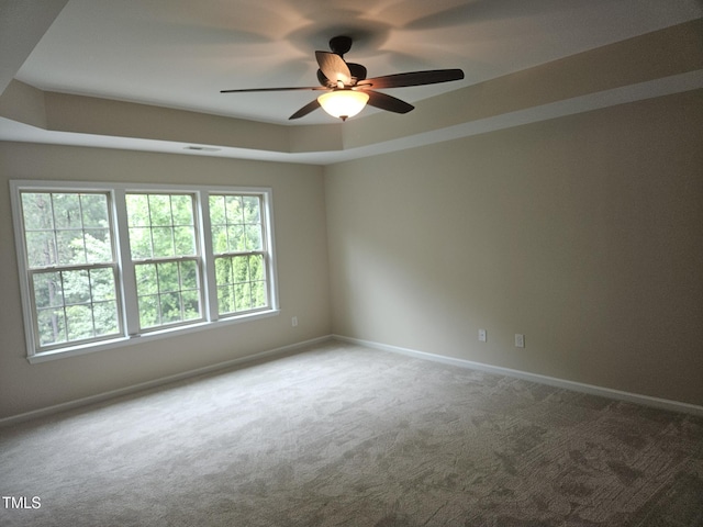 112 Briarfield Dr, Apex, NC 27502 - unfurnished room with ceiling fan, carpet flooring, baseboards, and a tray ceiling