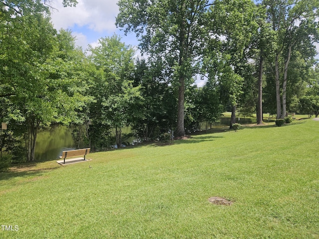 112 Briarfield Dr, Apex, NC 27502 - view of grassy yard featuring view of wooded area