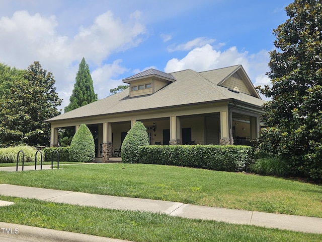 112 Briarfield Dr, Apex, NC 27502 - view of front facade featuring a front lawn, stone siding, and covered porch