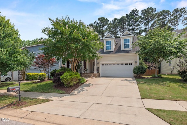 1612 Old Bramble Ln, Fuquay Varina, NC 27526 - view of front facade featuring driveway, a front lawn, and an attached garage