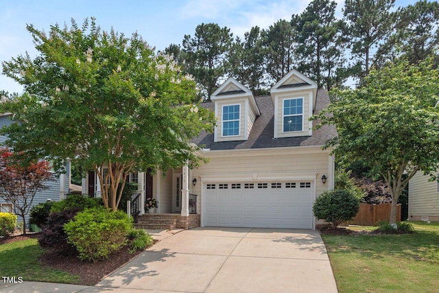 1612 Old Bramble Ln, Fuquay Varina, NC 27526 - view of front facade featuring concrete driveway, a garage, a shingled roof, and covered porch