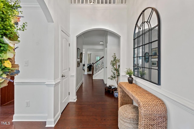 1612 Old Bramble Ln, Fuquay Varina, NC 27526 - foyer entrance featuring wood finished floors, stairway, arched walkways, and a towering ceiling